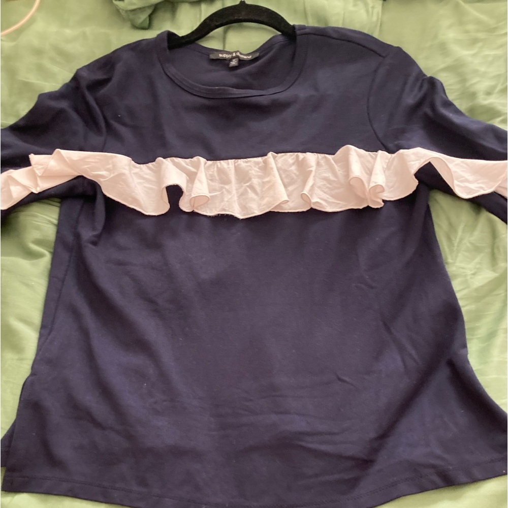 Adorable navy shirt with a white ruffle down both sleeves never worn size small